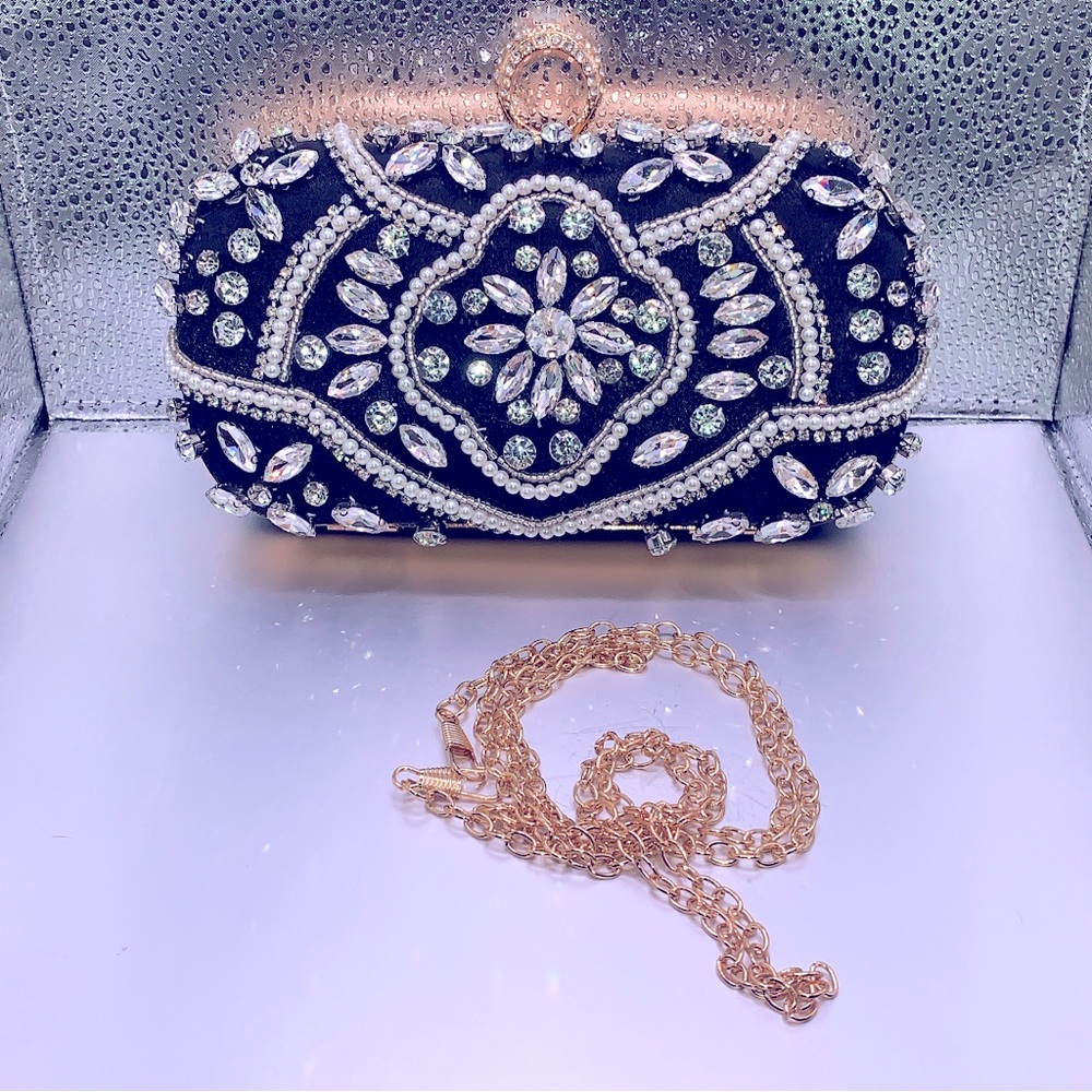 Black clutch decorated with clear rhinestones